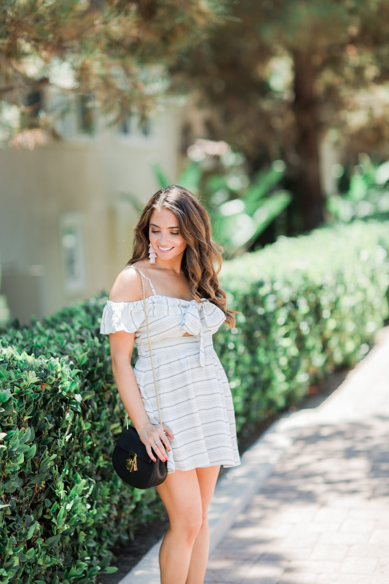 Cute Striped Dress with a Bow styled by popular Orange County fashion blogger, Maxie Elle