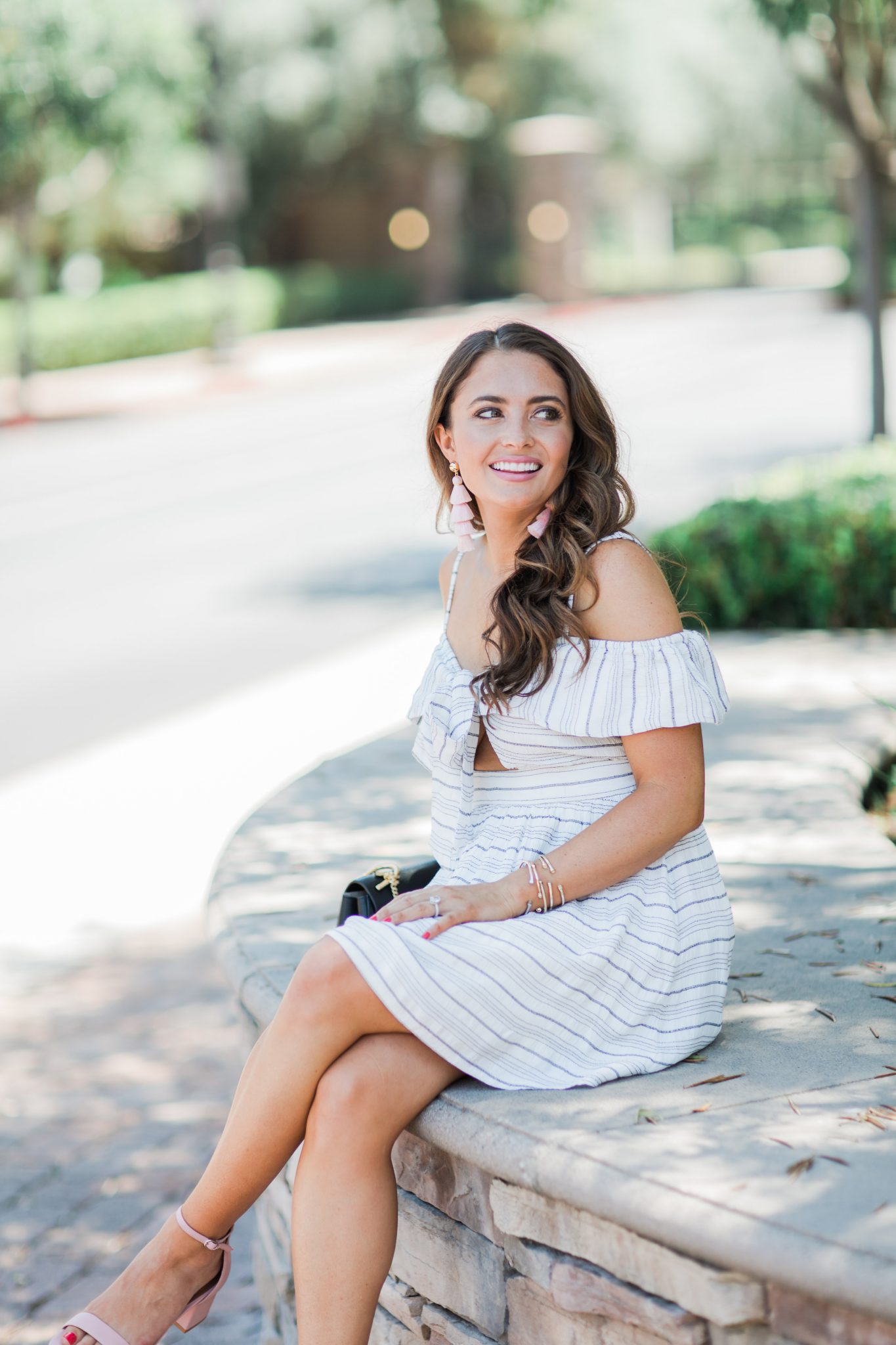Cute Striped Dress with a Bow styled by popular Orange County fashion blogger, Maxie Elle