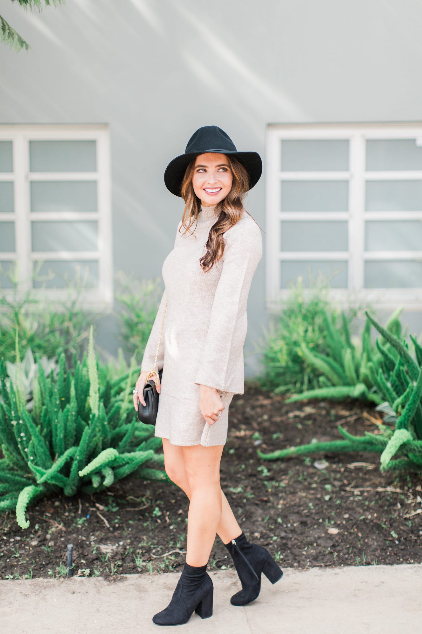 Maxie Elle | Neutral sweater dress with black hat and black booties - Wedding Skin Care Routine by popular Orange County style blogger Maxie Elle