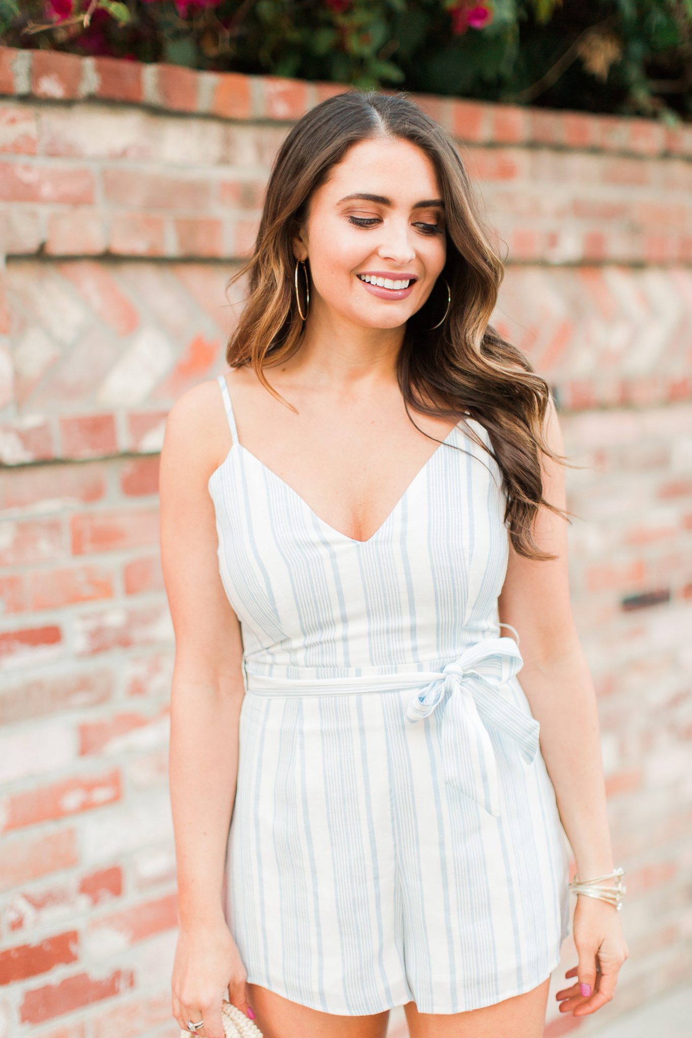 Blue and white REVOLVE striped romper with bow featured by popular Orange County fashion blogger, Maxie Elle